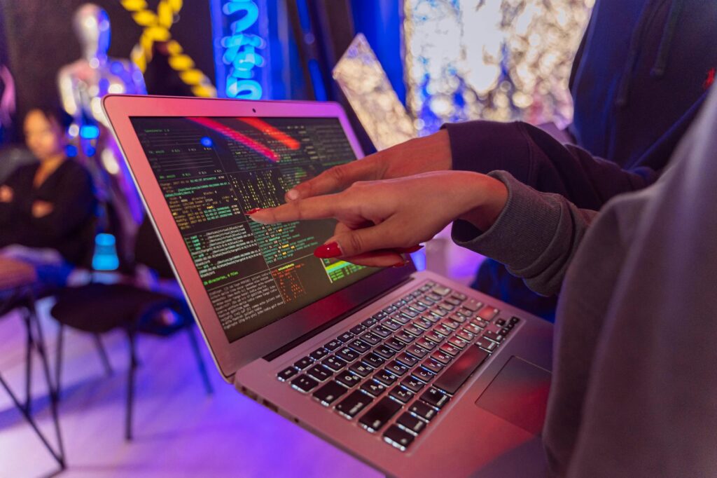 person using macbook air on table